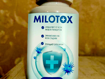 Баночка с капсулами Milotox на столе.